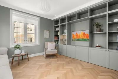 a living room with a couch and a chair at Unik villaeiendom, totalrenovert i klassisk stil in Trondheim