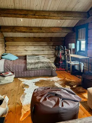 a bedroom with a bed and a desk in a room at Family Cabin With Panoramic Views In Aurdalsåsen in Aurdal