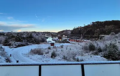 a view of a road with snow on the ground at Awesome Apartment In Finnås With House Sea View in Vinnes