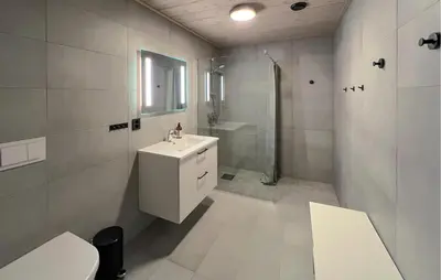 a white bathroom with a sink and a shower at Amazing Apartment In Øyer With Wifi in Øyer