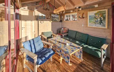 a living room with a couch and a table at Stunning Home In Austbygda With Wifi in Austbygdi