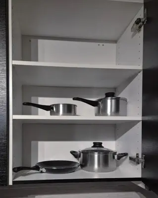 two pots and pans on a shelf in a kitchen at Cozy 2BD apartment in Central Bergen in Bergen