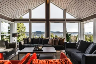 a living room with couches and a table at Mountain Cabin With Ski Inout In Trysil in Trysil