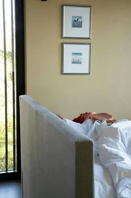 a bed in a room with two pictures on the wall at Modern Cabin By The Cross-Country Trails in Svene