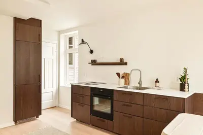 a kitchen with a sink and a stove at Modern 1BR in heart of old town in Bergen