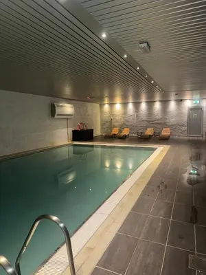 a large swimming pool in a large building at Lake Resort - Pool & Sauna in Vossevangen