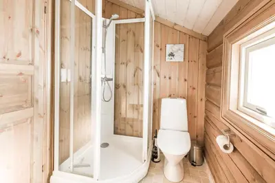 a bathroom with a shower and a toilet in it at Stranda Fjellgrend 3 bedrooms - 68B in Stranda