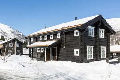 a log cabin in the snow with snow at Stranda Fjellgrend 3 bedrooms - 68A in Stranda