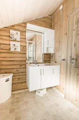a bathroom with a white sink and a toilet at Stranda Fjellgrend 3 bedrooms - 68A in Stranda