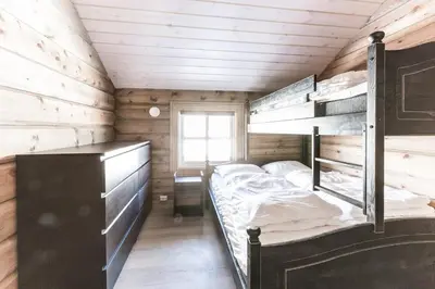 a bedroom with a bunk bed in a cabin at Stranda Fjellgrend 3 bedrooms - 68A in Stranda