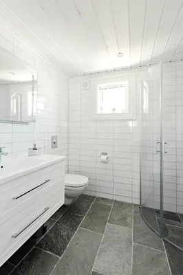 a white bathroom with a toilet and a sink at Stranda Fjellgrend 2 bedrooms and loft - 24B in Stranda