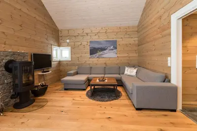 a living room with a couch and a tv at Stranda Fjellgrend 2 bedrooms and loft - 30B in Stranda