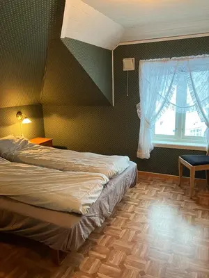 a bedroom with a bed and a window at Holiday home in Espevær in Bømlo