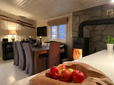 a bowl of fruit on a table with a fireplace at Mountain Cabin With Magical Views At Dagalifjell in Uvdal