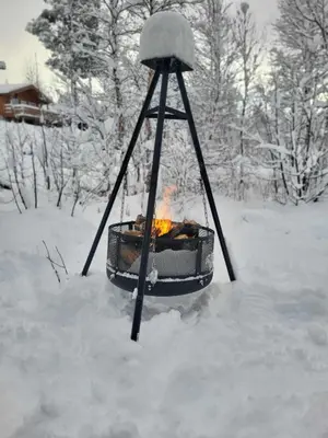 a fire in a swing in the snow at Bjorlicabin in Bjorli