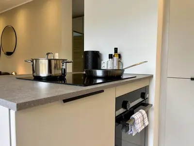 a kitchen with two pots and pans on a stove at Exclusive apartment in historical house, Bergen in Bergen