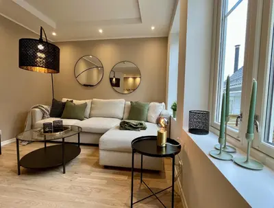 a living room with a couch and two tables at Beautiful apartment in Bergen in Bergen