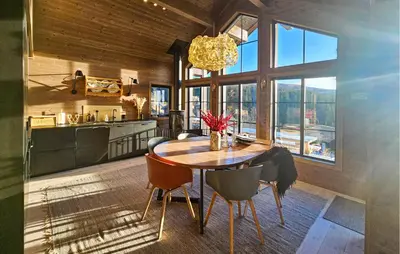 a kitchen and dining room with a table and chairs at Lovely Home In Eggedal With Wifi in Eggedal