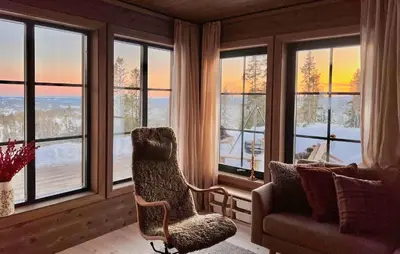 a living room with a chair and a couch and windows at Lovely Home In Eggedal With Wifi in Eggedal