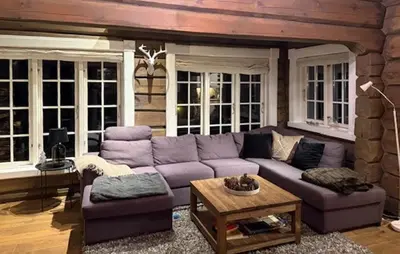 a living room with a purple couch and a table at 4 Bedroom Pet Friendly Home In Svingvoll in Svingvoll