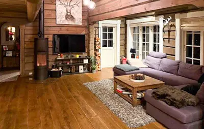 a living room with a purple couch and a fireplace at 4 Bedroom Pet Friendly Home In Svingvoll in Svingvoll