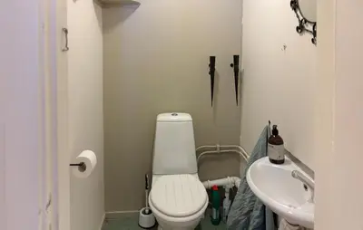 a small bathroom with a toilet and a sink at Cozy Home In Oppdal With House A Mountain View in Oppdal