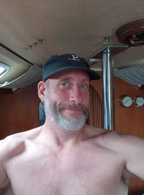 a shirtless man wearing a black hat at Bakarvågen 2