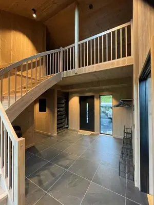 a large room with a staircase and a floor at Lovely Cabin With Hot Tub Near Syningtoppen in Torpo