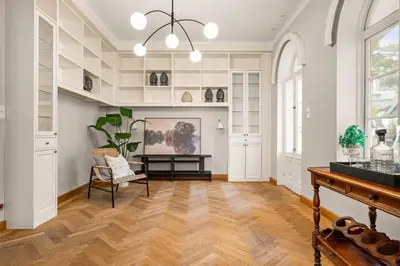 a living room with a table and a chair at Elegant Historic Villa - Stunning Views in Bergen