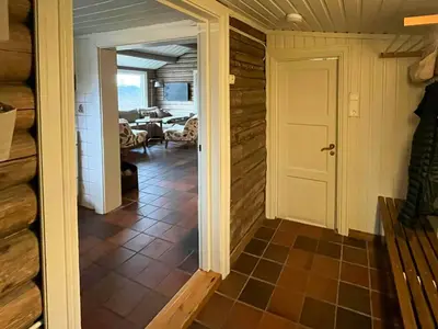 a hallway with a door leading to a living room at Timber Cabin With Ski-In Access At Solheisen in Hemsedal