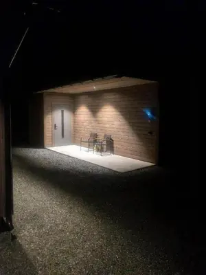 a room with two chairs and a building at night at Cabin With Ski Inout Near Stryn Alpine Resort in Stryn