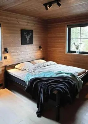 a bedroom with a large bed in a room at Cabin With Ski Inout Near Stryn Alpine Resort in Stryn