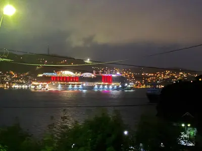 a view of a city at night with lights at Alesund apartment fantastic view in Ålesund