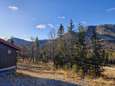 a cabin with a view of the mountains at Fjellvang in Haglebu