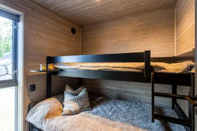 a room with two bunk beds in a cabin at Viking Lodge Panorama-Norefjell in Noresund