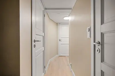 an empty hallway with a door and a room at Central Bergen - Stylish & Cozy in Bergen
