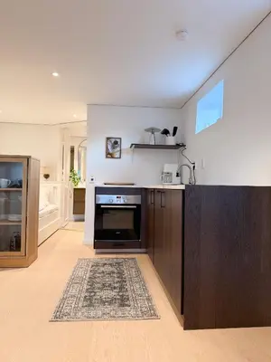 a kitchen with a stove and a counter top at Soft Stay Apartment in Bergen