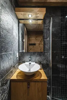 a bathroom with a sink and a shower at Charming cabin in Hemsedal Golf Alpin - ideal for families, fishing & skiing in Hemsedal