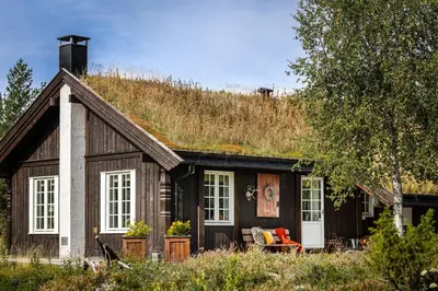 a small house with a grass roof at Charming cabin in Hemsedal Golf Alpin - ideal for families, fishing & skiing in Hemsedal