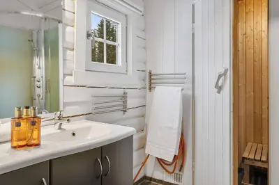 a bathroom with a sink and a mirror at Vikinggrenda 16A by Vacation Trysil in Trysil