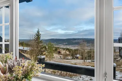 an open window with a view of the mountains at Trysilfjell hytteomrade 587 by Vacation Trysil in Hovi