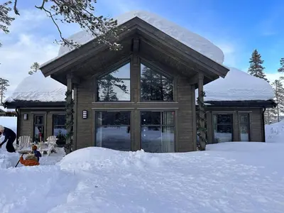 a house covered in snow with snow around it at Trysilfjell hytteomrade 2124 by Vacation Trysil in Hovi