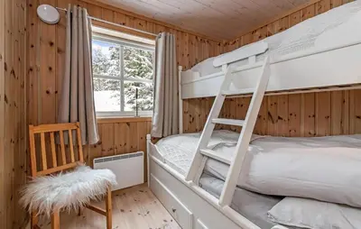 a bedroom with bunk beds and a window at 3 Bedroom Gorgeous Home In Nesbyen in Nesbyen