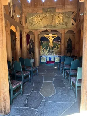a room with chairs and a altar in a church at Jørundgard Vikingcamp in Sel