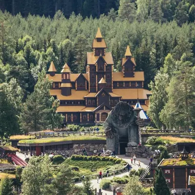 a large building with a statue in front of it at Family cabin in Hafjell, ski in-ski out in Hafjell