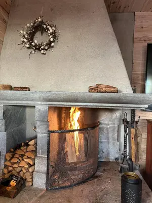a stone oven with a fire inside of it at Family cabin in Hafjell, ski in-ski out in Hafjell
