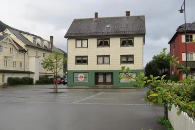 an empty parking lot in front of a building at Grodås Lake View Apartment in Hornindal