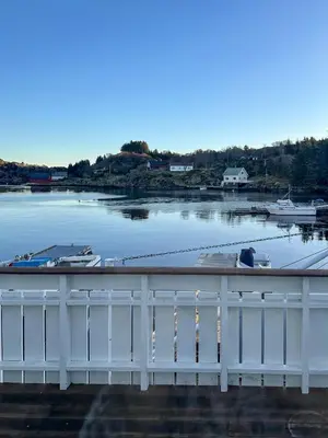 a view of a harbor with boats in the water at Fishermen's Cabin With Sea View in Bømlo