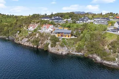 an aerial view of a house on an island in the water at RVH29 - Fjord Hideaway Villa in Veland