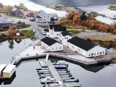 an aerial view of a harbor with boats in the water at 5 person holiday home in Flatanger in Vik